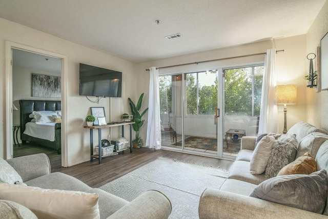 living room with dark wood-type flooring