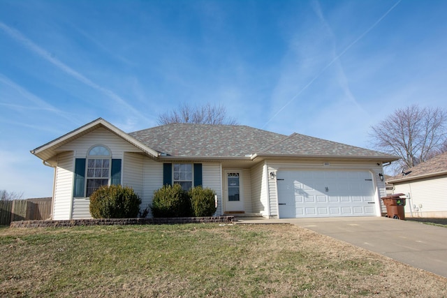 ranch-style home with a garage and a front lawn