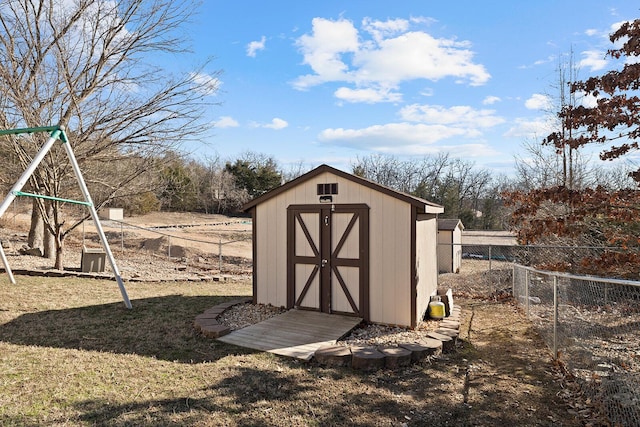 view of outbuilding with a playground