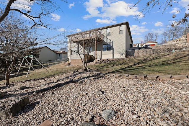 rear view of property with a yard