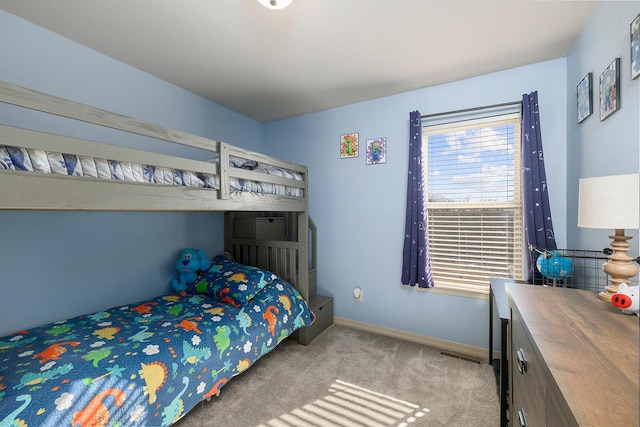 bedroom featuring light carpet