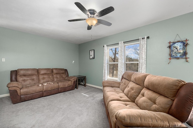 carpeted living room with ceiling fan