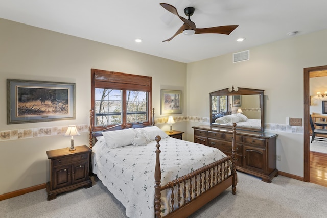 bedroom featuring light colored carpet and ceiling fan