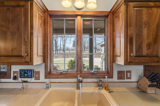 kitchen featuring a healthy amount of sunlight and sink