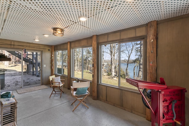 sunroom with a water view