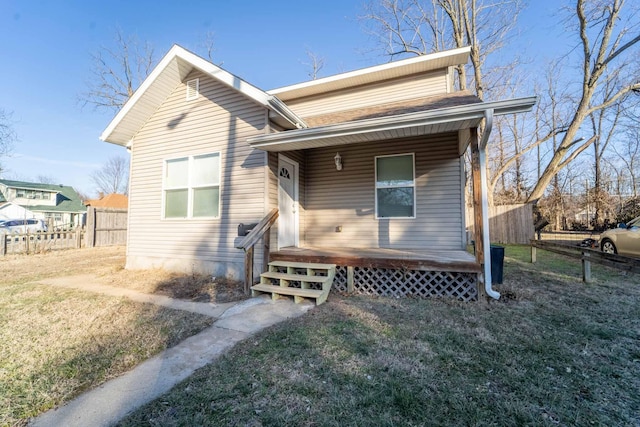 view of front of home featuring a porch and a front yard