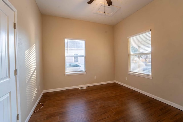 unfurnished room with ceiling fan and dark hardwood / wood-style flooring