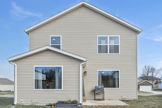 back of house with a garage