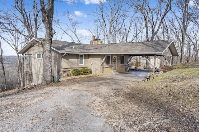 single story home with a carport