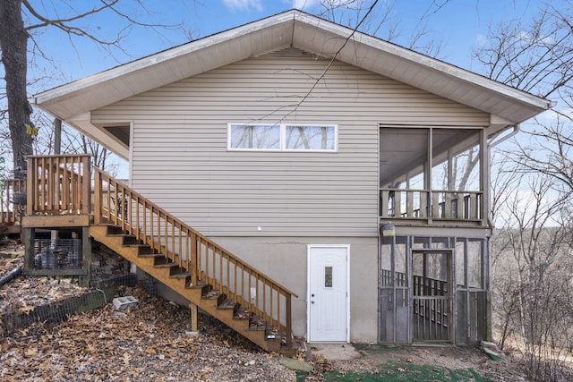 rear view of house with a sunroom