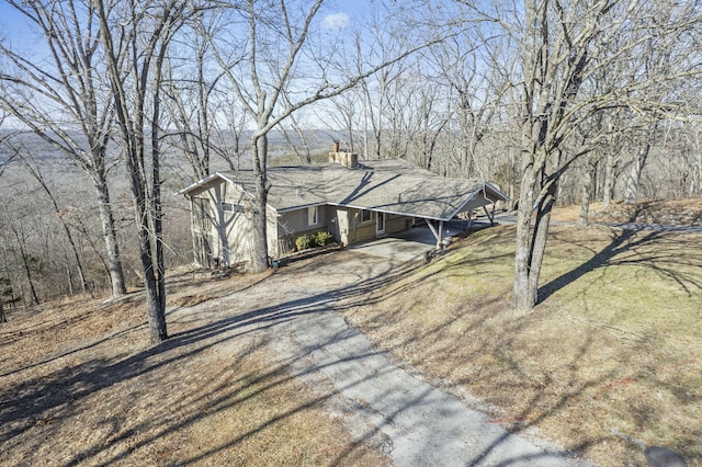 view of front of home with a carport