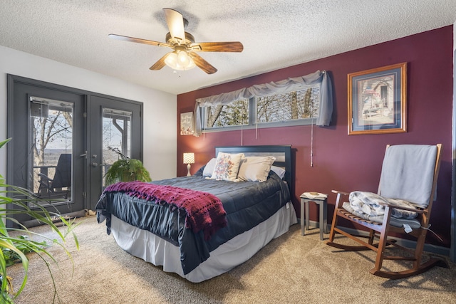 carpeted bedroom featuring a textured ceiling, access to outside, french doors, and ceiling fan