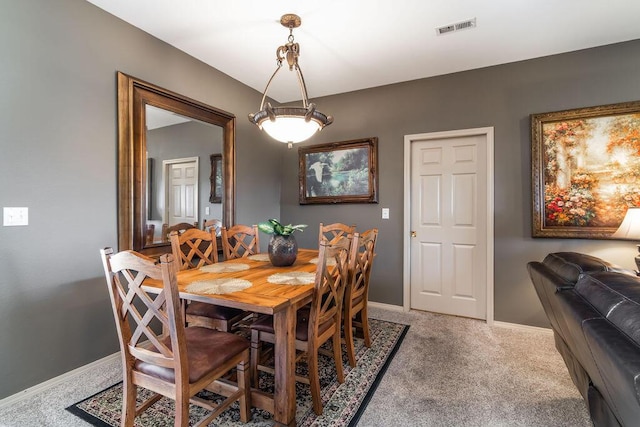 view of carpeted dining area