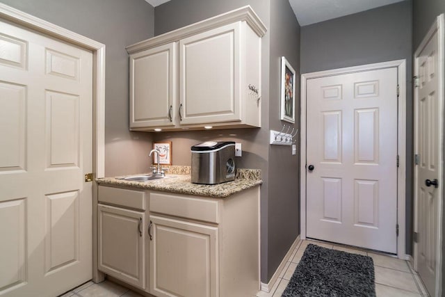 kitchen with sink and light tile patterned floors