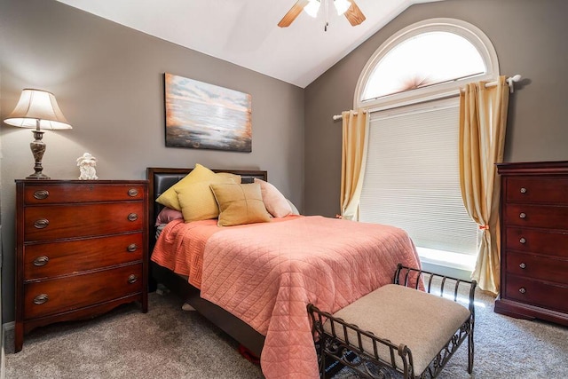 carpeted bedroom featuring multiple windows, lofted ceiling, and ceiling fan