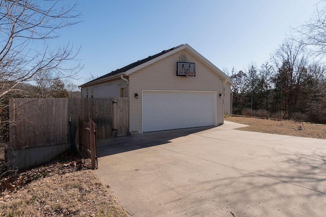 view of property exterior with an outbuilding and a garage