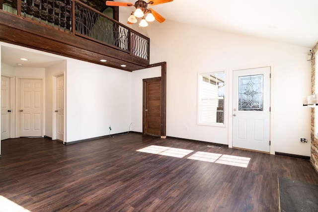 entrance foyer featuring ceiling fan, dark hardwood / wood-style flooring, and high vaulted ceiling