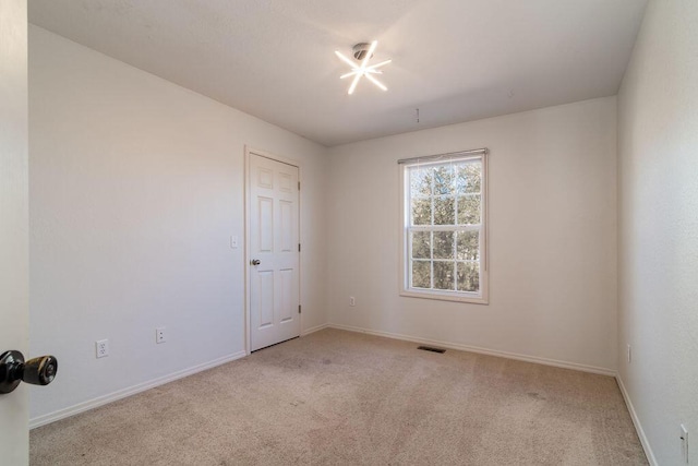 view of carpeted spare room