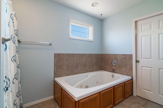 bathroom with tile patterned floors and a bathtub