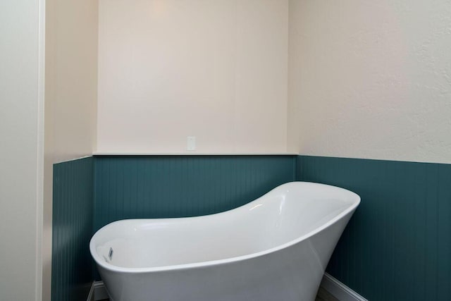 bathroom featuring a tub to relax in