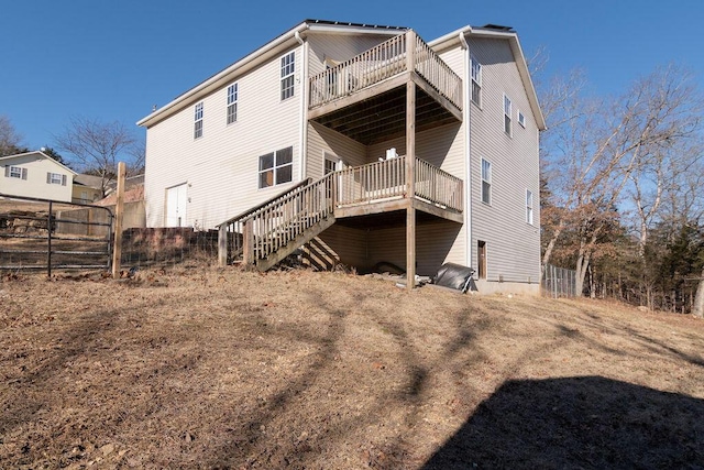 rear view of property with a wooden deck