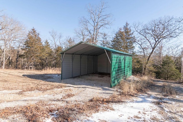 view of outbuilding featuring a carport