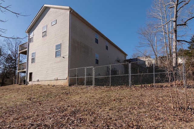 view of side of home with a balcony