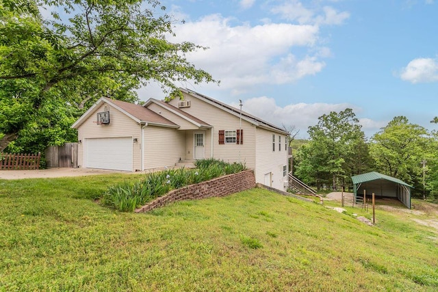 view of front of property featuring concrete driveway and an attached garage