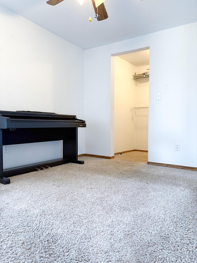 interior space featuring ceiling fan