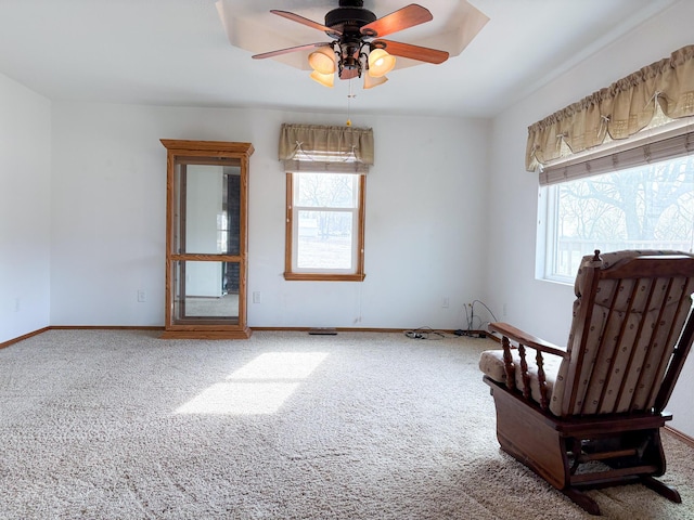 sitting room with carpet floors and ceiling fan