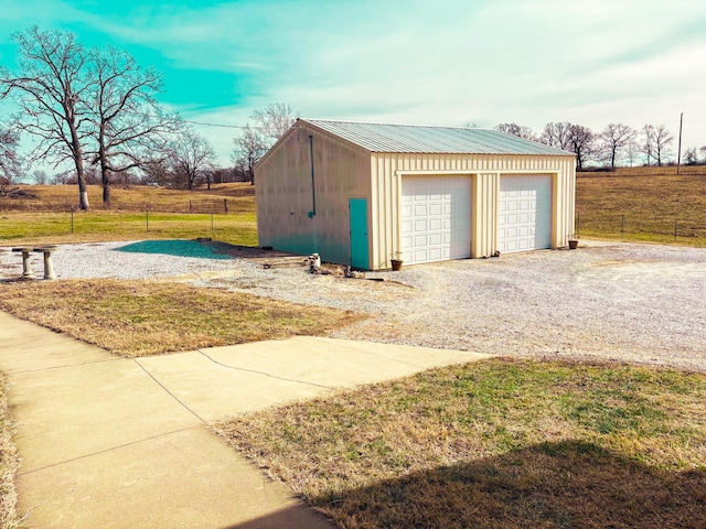 garage featuring a yard