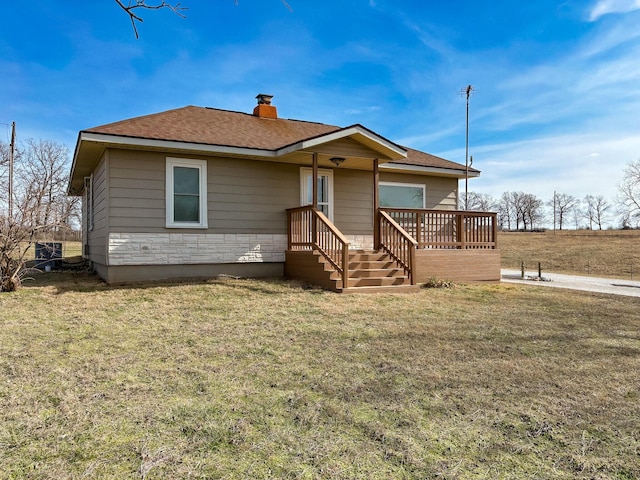 bungalow-style house with a front lawn