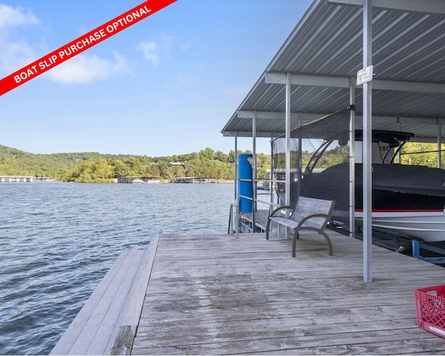 view of dock featuring a water view and boat lift