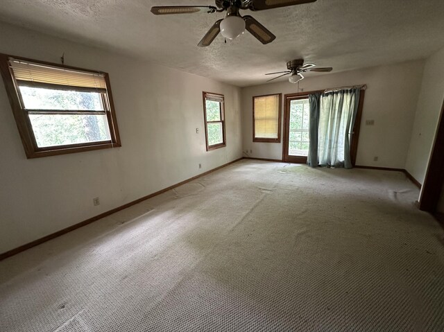 406 Red Bridge Rd, Ozark, MO 65721 - empty room featuring a textured ceiling, a ceiling fan, and light carpet