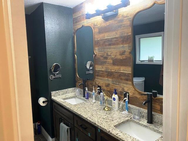 bathroom with tile patterned floors and vanity