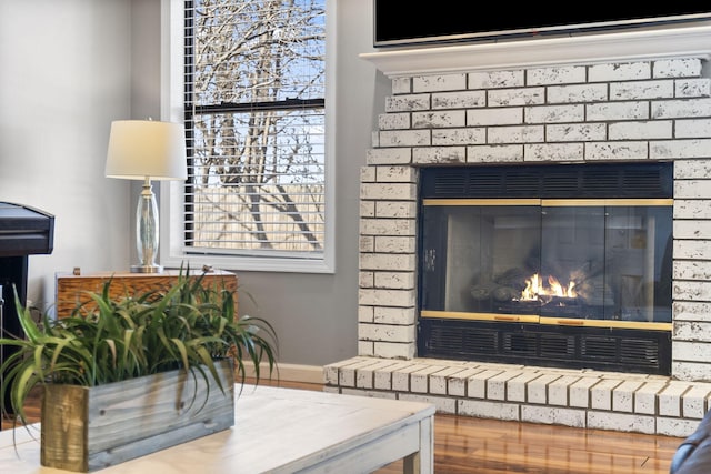 interior details with a brick fireplace