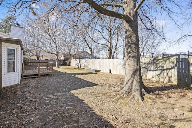 view of yard with a wooden deck