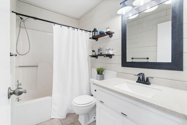 full bathroom with vanity, shower / bathtub combination with curtain, tile patterned floors, and toilet