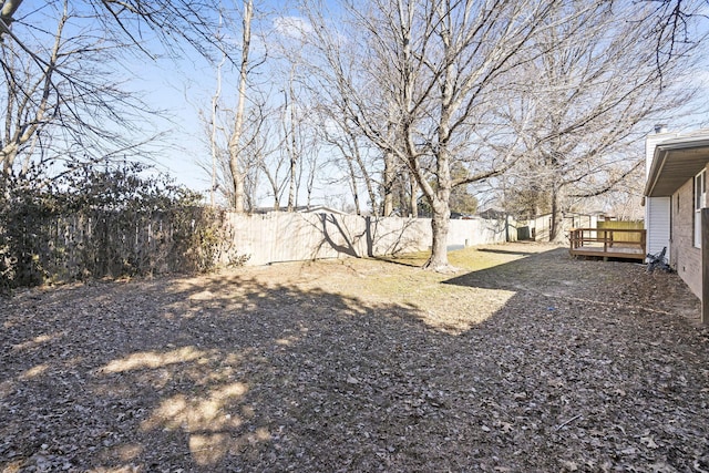 view of yard featuring a wooden deck