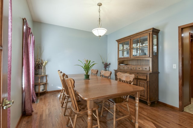 dining area featuring dark hardwood / wood-style flooring