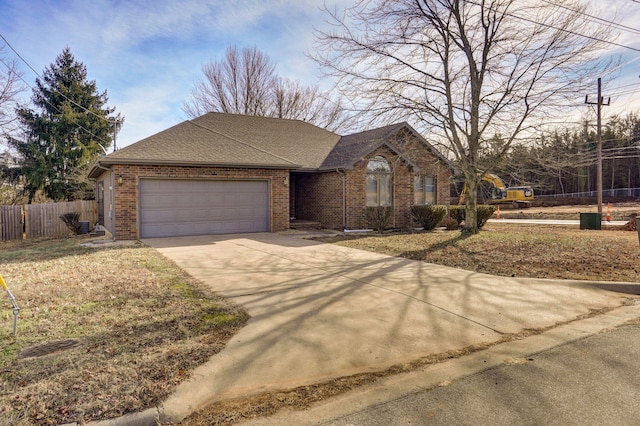 ranch-style house featuring a garage