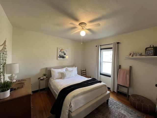 bedroom with ceiling fan and wood finished floors