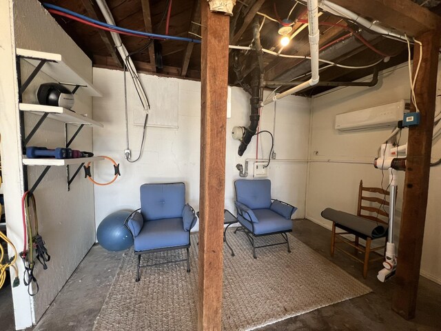 unfinished basement featuring an AC wall unit