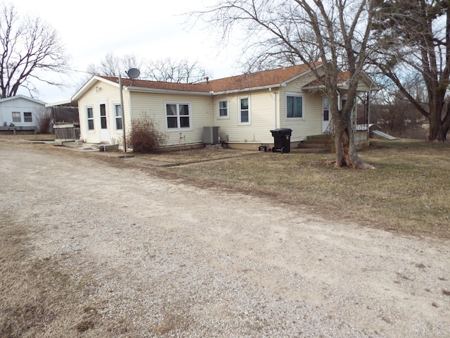 rear view of property featuring central air condition unit