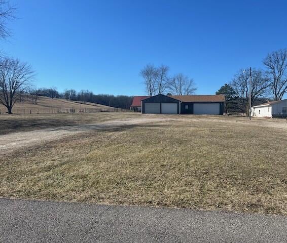 view of yard with a rural view