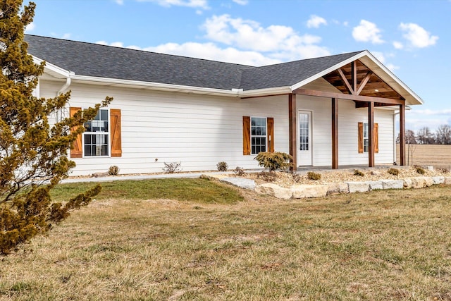 exterior space with a yard and a porch