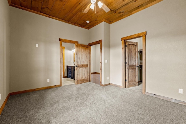 unfurnished bedroom with wood ceiling, ceiling fan, and light carpet