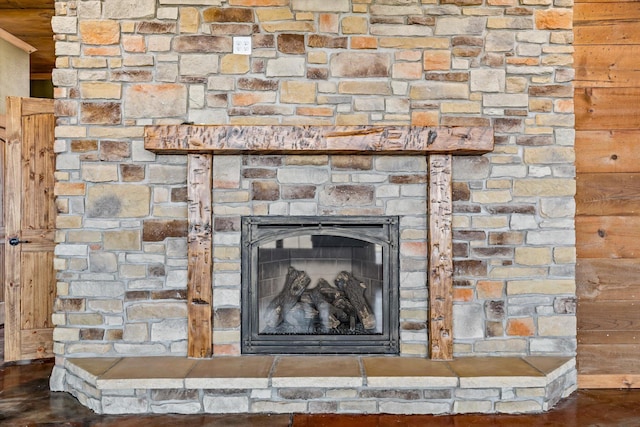 interior details with a stone fireplace