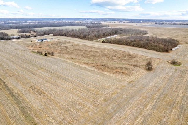 birds eye view of property with a rural view