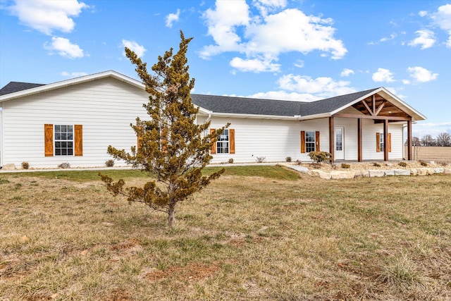 ranch-style house with a front lawn